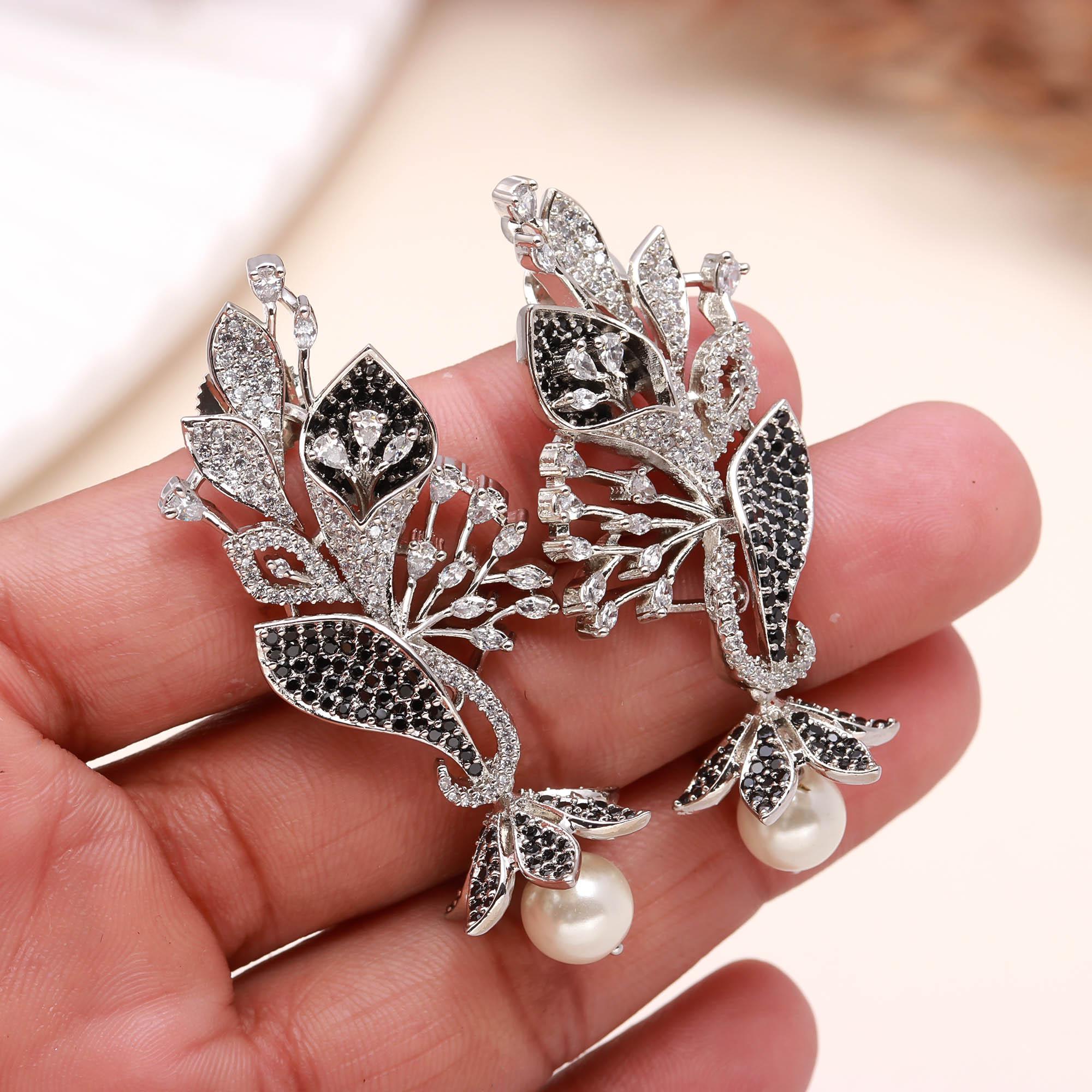 Luxury Black and White American Diamond (AD) Floral Pearl Dangler Earrings - Haamsi