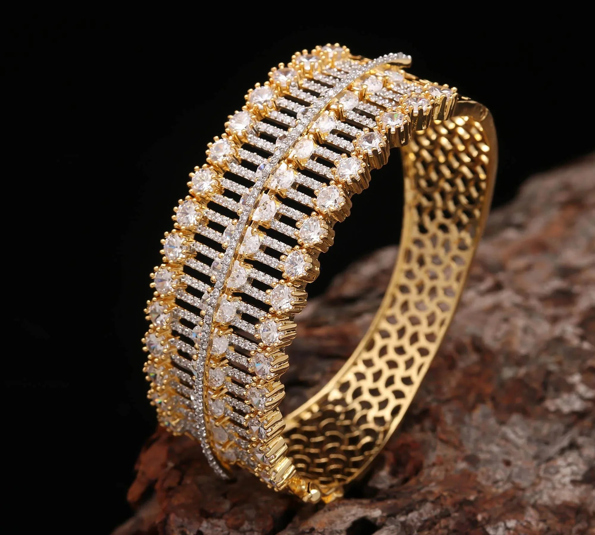 Haamsi gold bracelet with intricate lattice design and rows of sparkling white gemstones